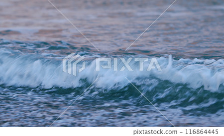 Beautiful Evening Nature Sea Background. Sunset Reflection On The Water Surface. Splashes Of Blue Water In The Open Sea. Static view. Beautiful Evening Nature Sea Background. Sunset Reflection On The Water Surface. Splashes Of Blue Water In The Open Sea. Static view. 116864445