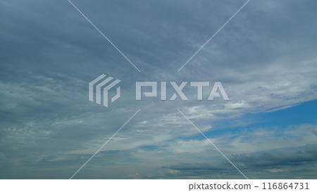 Layers Of Different Cloud Types With Blue Skies Cloudscape Background. Water Vapor Condense To Form Huge Cloud. Layers Of Different Cloud Types With Blue Skies Cloudscape Background. Water Vapor Condense To Form Huge Cloud. 116864731