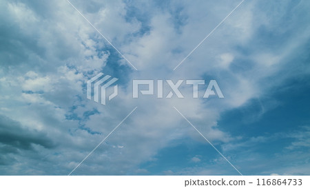 Light Cloudscape. Nature Landscape. Summer Blue Sky. Nature Weather Blue Sky With Clouds Moving In Opposite Direction. 116864733