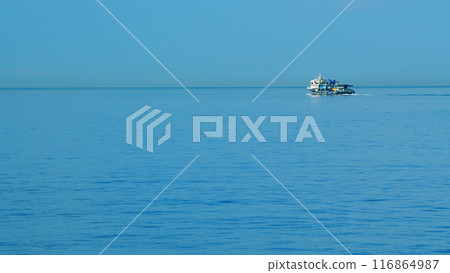 Fishing Boat Sailing .Ship Floats On Sea Surface With Blue Sky Leaving Path Sea Foam Water. Still. Fishing Boat Sailing .Ship Floats On Sea Surface With Blue Sky Leaving Path Sea Foam Water. Still. 116864987