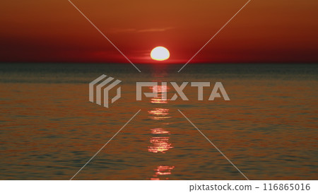 Concept - Vacation And Relax. Sea Surface At Sunset. Summer Landscape. Orange Sea At Sunset. Slow motion. 116865016