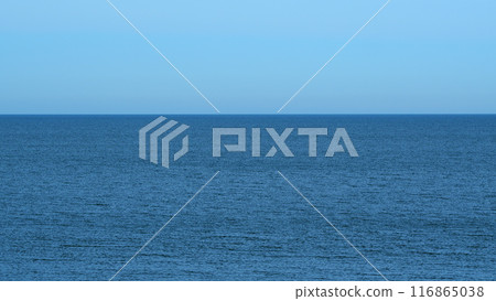 Wavy Sea With Horizon At A Blue Sky. Calming Waves Of The Sea Or Ocean. Sunny Summer Day. Real time. Wavy Sea With Horizon At A Blue Sky. Calming Waves Of The Sea Or Ocean. Sunny Summer Day. Real time. 116865038