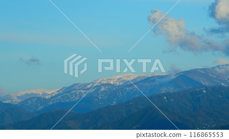 Dramatic Colorful Clouds Over Blue Hills. Landscape With Fog In Mountains And Rows Of Trees. Dramatic Colorful Clouds Over Blue Hills. Landscape With Fog In Mountains And Rows Of Trees. 116865553