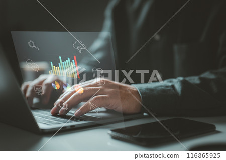 Person typing on a laptop with various data charts and icons. It symbolizes the use of digital technology for data analysis, communication, and cloud computing in a modern work environment. Person typing on a laptop with various data charts and icons. It symbolizes the use of digital technology for data analysis, communication, and cloud computing in a modern work environment. 116865925