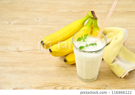 Breakfast: banana juice, banana milk, milk banana, crushed ice. Banana + milk + ice + sugar in a blender. Breakfast: banana juice, banana milk, milk banana, crushed ice. Banana + milk + ice + sugar in a blender. 116866122