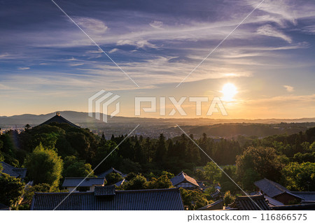 Summer 2024: Evening view of Nigatsudo Hall at Todaiji Temple in Nara. The western sky gradually darkens. The western sky turns golden. 116866575