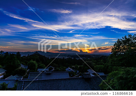 Summer 2024 Evening view of Nigatsudo Hall at Todaiji Temple in Nara. The western sky gradually darkens. The sun sets, painting the western sky golden. 116866616