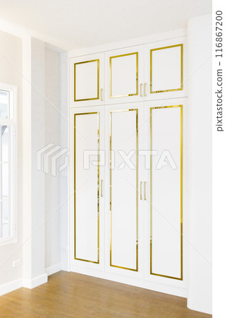 "Elegant white and gold cabinetry, showcasing a luxurious and clean design. Perfect for modern interior decor and stylish home inspiration." "Elegant white and gold cabinetry, showcasing a luxurious and clean design. Perfect for modern interior decor and stylish home inspiration." 116867200