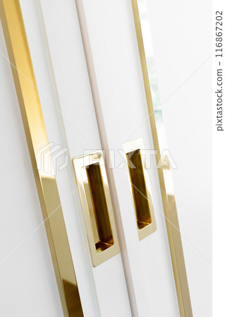 "Elegant white and gold cabinetry, showcasing a luxurious and clean design. Perfect for modern interior decor and stylish home inspiration." "Elegant white and gold cabinetry, showcasing a luxurious and clean design. Perfect for modern interior decor and stylish home inspiration." 116867202