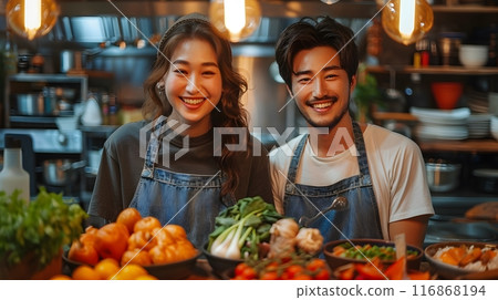 An Asian couple having happy time together at the kitchen. 116868194