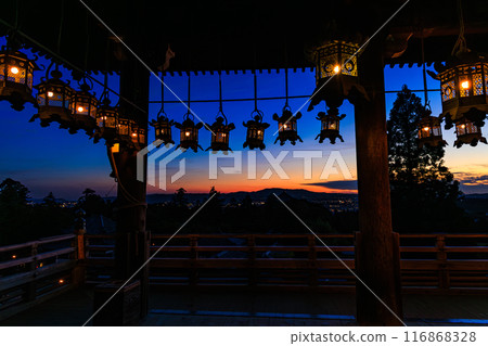 Summer 2024 Evening view of Nigatsudo Hall, Todaiji Temple, Nara Beautiful sunset sky seen through the lit lanterns on the stage Wide angle① 116868328