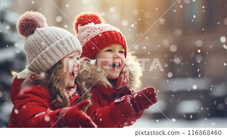 Kids building snow man playing outdoors on sunny snowy winter day. Outdoor family fun on Christmas vacation. Kids building snow man playing outdoors on sunny snowy winter day. Outdoor family fun on Christmas vacation. 116868460