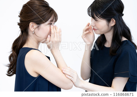 A middle-aged woman comforting a sad young woman A middle-aged woman comforting a sad young woman 116868671