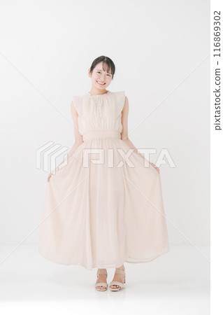 Young woman wearing a dress Young woman wearing a dress 116869302