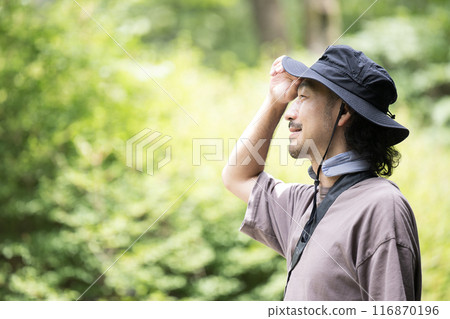 Profile of a man enjoying the outdoors in summer Profile of a man enjoying the outdoors in summer 116870196