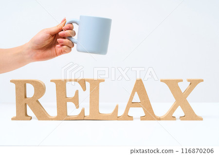 Wooden alphabet blocks arranged with the word "RELAX" Wooden alphabet blocks arranged with the word "RELAX" 116870206