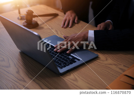 Judge gavel with Justice lawyers having team meeting at law firm background. Concepts of Law and Legal services. 116870870