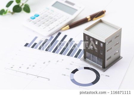 Corporate office building with graphs and calculator 116871111