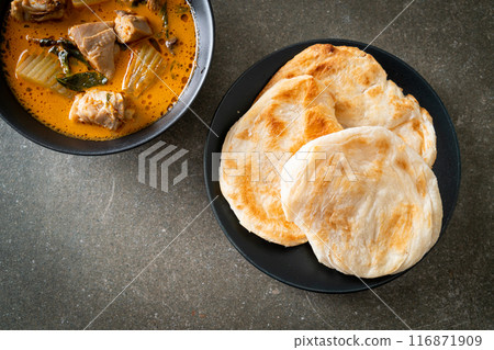 Chicken curry soup with roti Chicken curry soup with roti 116871909