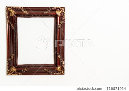 empty picture frame on white wall background empty picture frame on white wall background 116871934