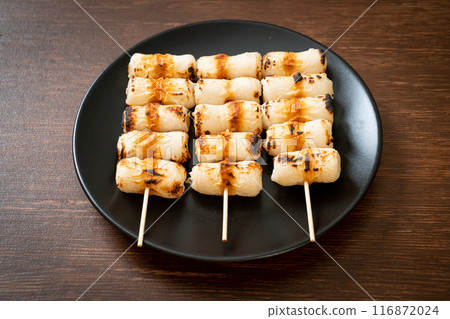 grilled tube shaped fish paste cake skewe or tube squid skewer 116872024