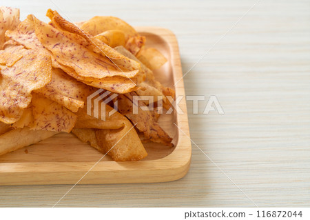 Taro Chips - fried or baked sliced taro 116872044