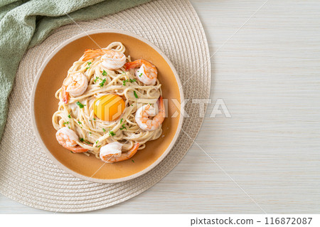 spaghetti white cream sauce with shrimps and egg yolk spaghetti white cream sauce with shrimps and egg yolk 116872087