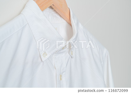 hanging shirt with wood hanger on wall hanging shirt with wood hanger on wall 116872099