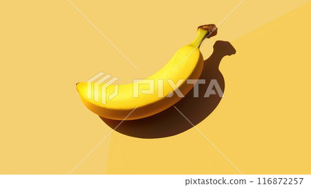 A banana is sitting on a yellow surface 116872257