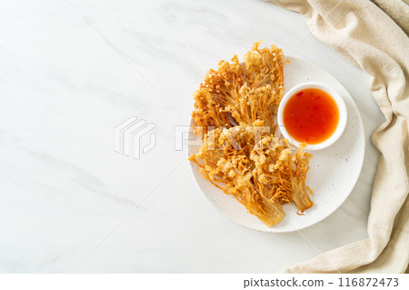deep fried enoki mushroom or golden needle mushroom with spicy dipping sauce deep fried enoki mushroom or golden needle mushroom with spicy dipping sauce 116872473