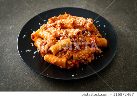 Rigatoni pasta bolognese with cheese Rigatoni pasta bolognese with cheese 116872497