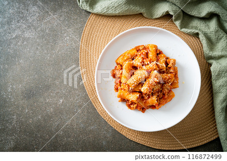 Rigatoni pasta bolognese with cheese Rigatoni pasta bolognese with cheese 116872499