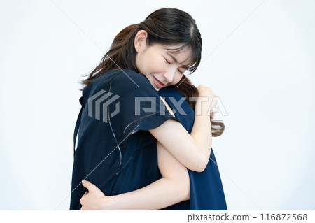 Two women hugging Two women hugging 116872568