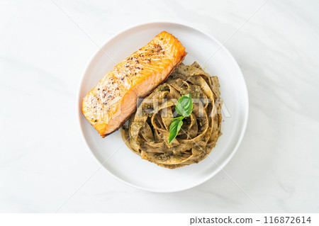 pesto fettuccine spaghetti pasta with grilled salmon fillet pesto fettuccine spaghetti pasta with grilled salmon fillet 116872614
