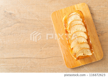 apple loaf crumbled on wood board apple loaf crumbled on wood board 116872623