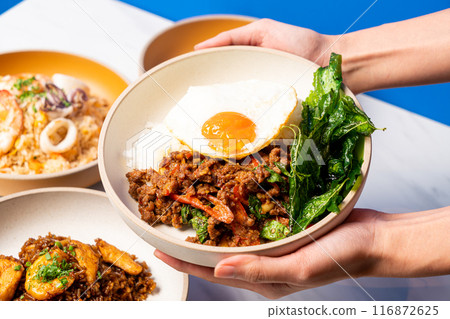 Stir fried Thai basil with wagyu beef and fried egg 116872625