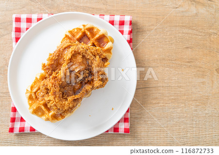 fried chicken waffle with honey or maple syrup 116872733