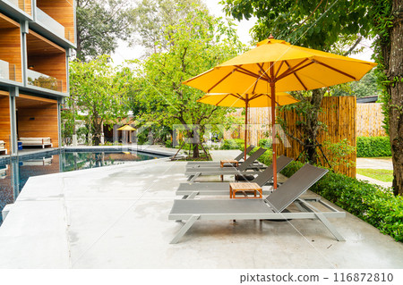 umbrella and pool bed around swimming pool umbrella and pool bed around swimming pool 116872810