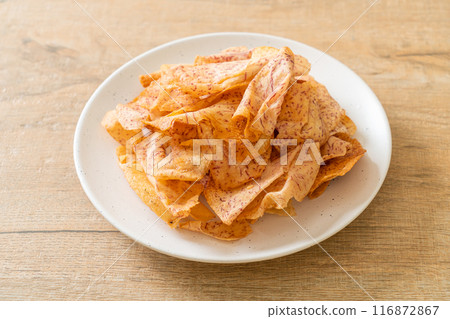 Taro Chips - fried or baked sliced taro Taro Chips - fried or baked sliced taro 116872867