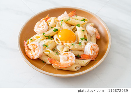 penne pasta white cream sauce with shrimps and egg penne pasta white cream sauce with shrimps and egg 116872989