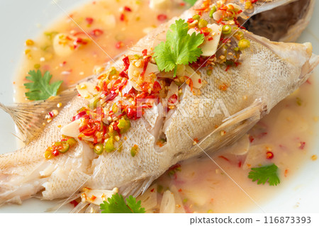 Steamed grouper fish with lime and chillies Steamed grouper fish with lime and chillies 116873393