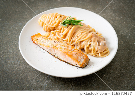 grilled salmon with spaghetti creamy tomato sauce 116873457