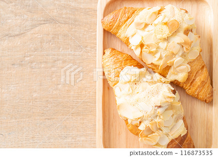 croissant with cream and almonds croissant with cream and almonds 116873535