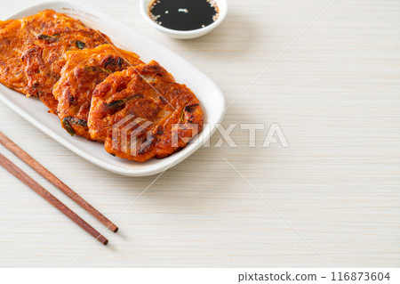 Korean Kimchi pancake or Kimchijeon - Fried Mixed Egg, Kimchi, and Flour 116873604