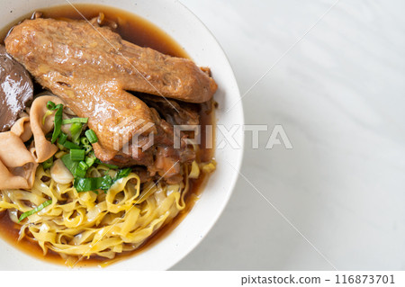 egg noodles with stewed and braised duck in brown soup egg noodles with stewed and braised duck in brown soup 116873701