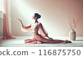Woman in a relaxing yoga pose in stylish interior 116875750