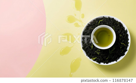 Green tea leaves background pastel yellow 116878147