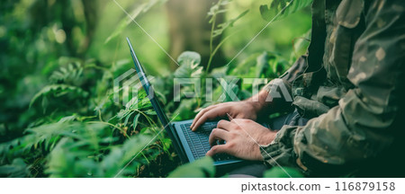 Hands type on a laptop surrounded by a lush, green environment. The concept of the integration of technology with nature and environmental sustainability. Generative AI. Hands type on a laptop surrounded by a lush, green environment. The concept of the integration of technology with nature and environmental sustainability. Generative AI. 116879158