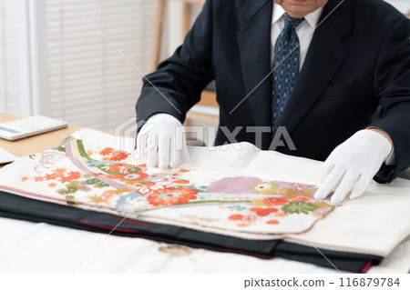 Man assessing recycling purchase Man assessing recycling purchase 116879784
