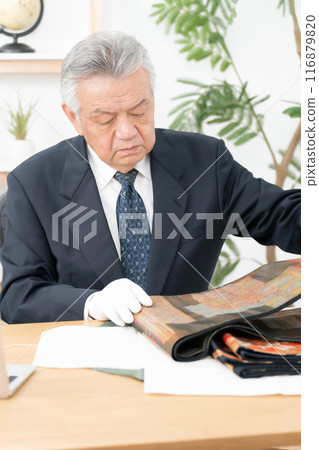Man assessing recycling purchase Man assessing recycling purchase 116879820
